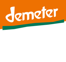 KI generiert: Das Bild zeigt das Demeter-Logo auf orangegrünem Hintergrund.